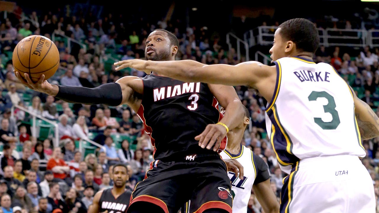 Wade fights off illness, scores 29 to lead Heat past Jazz